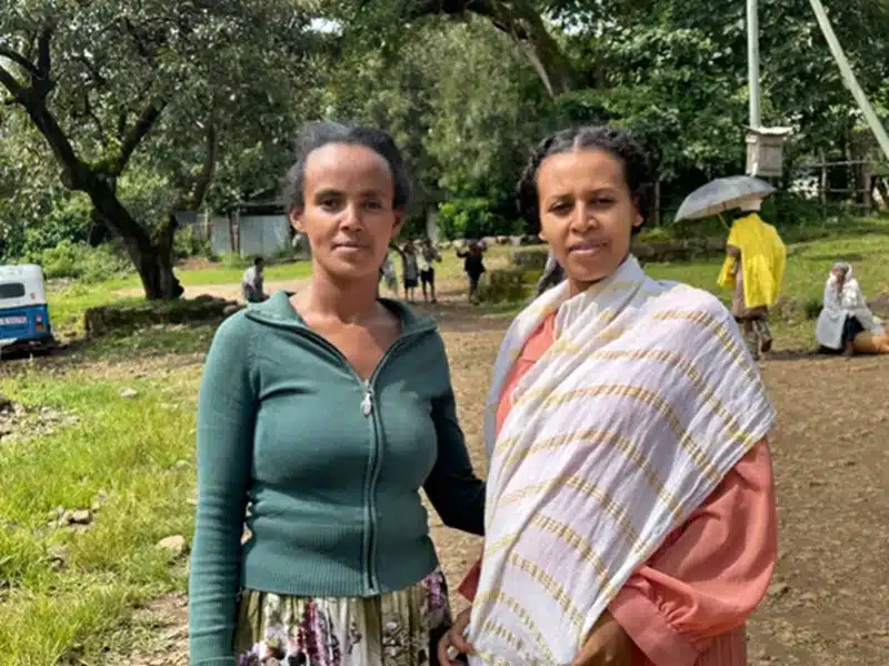 Aregash Nuru, left, a 30-year-old accountant and local tour guide in Awra Amba [Peter Yeung/Al Jazeera]